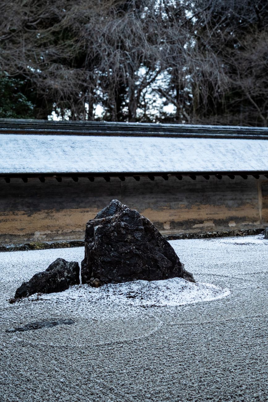 Kyoto garden with ancient stone lantern and moss