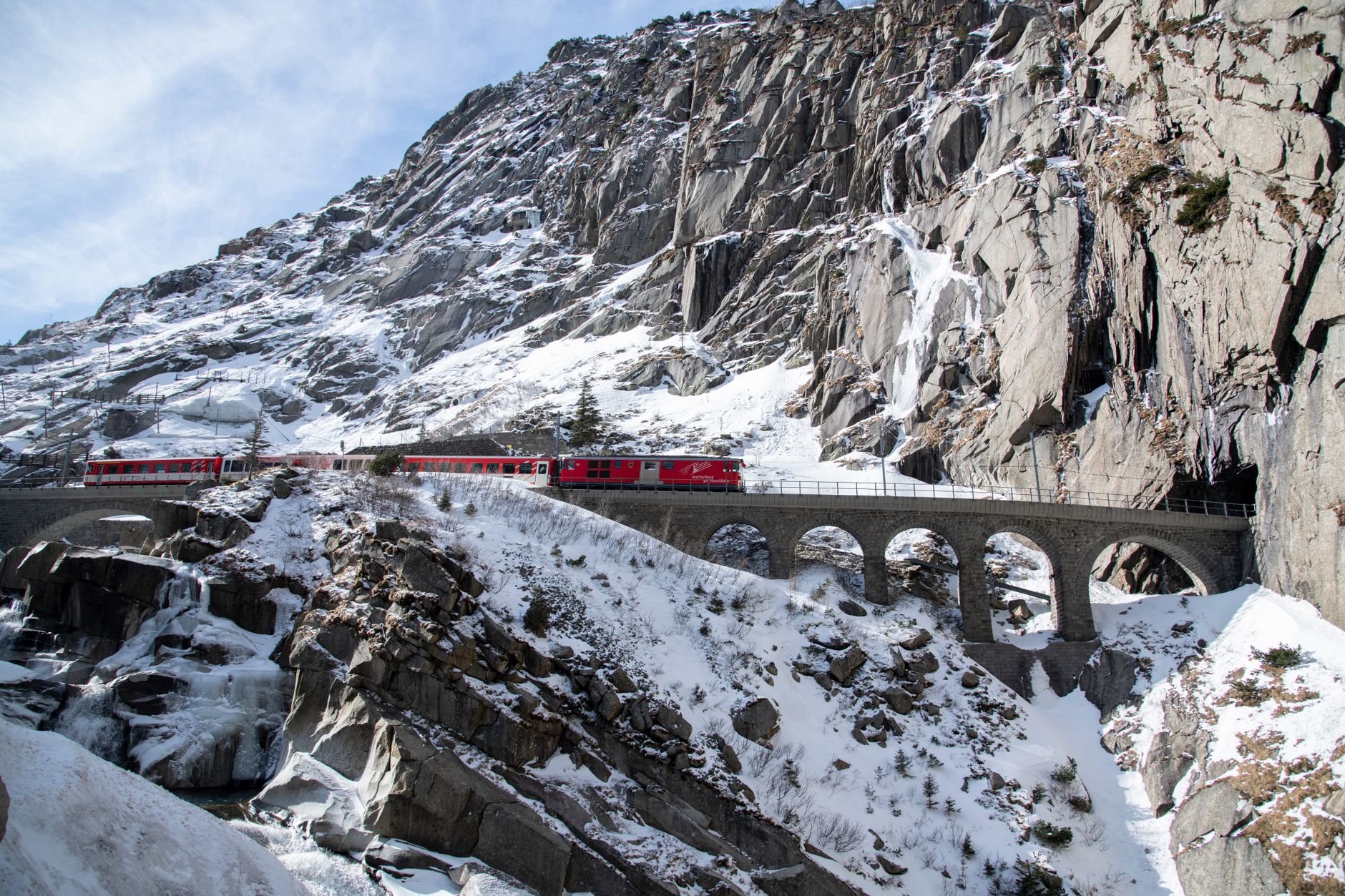 Scenic train winding through Swiss mountains